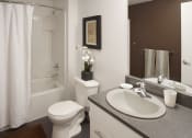 Thumbnail 7 of 18 - a bathroom with a sink toilet and a bath tub