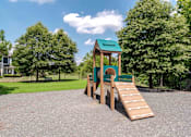 Thumbnail 13 of 14 - A playground with a green roof and a slide.