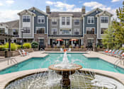 Thumbnail 1 of 14 - building exterior with water fountain and swimming pool