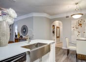 Thumbnail 6 of 25 - The Ascent at Windward apartments in Alpharetta Georgia photo of dining area with view to kitchen