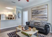 Thumbnail 9 of 25 - The Ascent at Windward apartments in Alpharetta Georgia photo of living room with ceiling fan