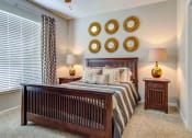 Thumbnail 12 of 25 - The Ascent at Windward apartments in Alpharetta Georgia photo of bedroom with large window and ceiling fan