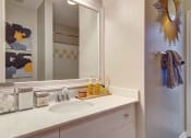 Thumbnail 13 of 25 - Alpharetta Apartments – The Ascent at Windward – luxury bathroom with long vanity and granite countertops