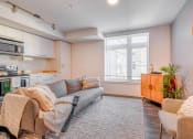 Thumbnail 5 of 18 - a living room with a couch and two chairs