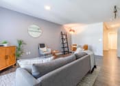 Thumbnail 8 of 18 - a living room with a couch and chairs