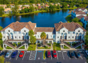 Thumbnail 30 of 33 - Apartments In Coconut Creek for Rent – Waterview at Coconut Creek – aerial view of community building in front of lake