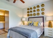Thumbnail 10 of 25 - Alpharetta Apartments – The Ascent at Windward – master bedroom with plush carpeting and ceiling fan