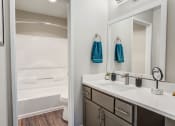 Thumbnail 11 of 31 - our apartments offer a bathroom with a shower and tub