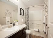 Thumbnail 16 of 27 - Newly Renovated Apartments in Wilsonville - Bridge Creek - Large Updated Bathrooms with Brown Cabinetry