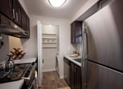 Thumbnail 8 of 27 - Pet-Friendly Apartments - Wilsonville, Oregon - Bridge Creek Apartments - Kitchens with