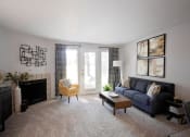 Thumbnail 4 of 27 - Wilsonville, OR - Bridge Creek Apartments - living room with a couch and a fireplace