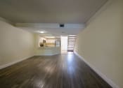 Thumbnail 13 of 33 - Apartments In Coconut Creek for Rent – Waterview at Coconut Creek – living room with wood floors and a staircase