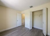 Thumbnail 16 of 33 - Apartments In Coconut Creek for Rent – Waterview at Coconut Creek – bedroom and closet of an empty apartment
