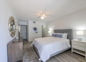 Thumbnail 10 of 33 - Apartments In Coconut Creek for Rent – Waterview at Coconut Creek – bedroom with ceiling fan, hardwood floors, a bed and a dresser