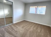 Thumbnail 7 of 8 - an empty room with carpet and a mirrored closet