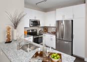 Thumbnail 12 of 63 - Fully equipped kitchen at Harrison at Reston Town Center, Reston, VA, 20190