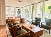 Thumbnail 10 of 36 - A room with a long table and chairs at Calvert House Apartments, Washington, DC 20008