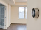 Thumbnail 8 of 15 - A room with a window and a door.