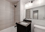 Thumbnail 5 of 59 - Quebec House dark renovated bathroom