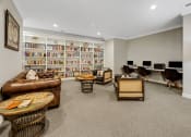Thumbnail 17 of 26 - the living room has a library and a desk with computers