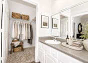 Thumbnail 18 of 18 - A bathroom with a white sink and a mirror.