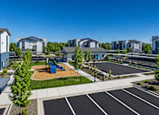 Thumbnail 11 of 33 - Community playground and parking area at Silver Ridge Apartments, Meridian, 83642
