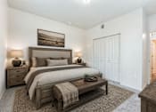 Thumbnail 29 of 33 - Spacious bedroom with rustic wood furniture at Silver Ridge Apartments, Meridian