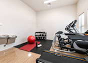 Thumbnail 7 of 33 - Fitness center with cardio equipment and free weights at Silver Ridge Apartments, Meridian, ID 83642