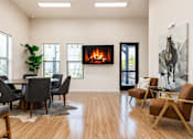 Thumbnail 12 of 33 - Clubhouse lounge with fireplace and seating at Silver Ridge Apartments, Meridian, 83642