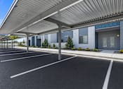 Thumbnail 10 of 33 - Covered parking area with metal canopy at Silver Ridge Apartments, Meridian