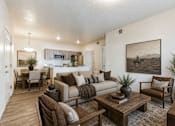 Thumbnail 16 of 33 - Open living room with wood accents and artwork at Silver Ridge Apartments, Meridian, ID
