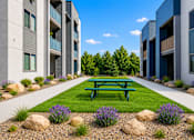 Thumbnail 2 of 33 - Courtyard with picnic table and landscaping at Silver Ridge Apartments, Meridian, Idaho