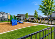 Thumbnail 5 of 33 - Playground with slide and fitness court at Silver Ridge Apartments, Idaho