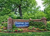 Thumbnail 1 of 13 - Property entrance sign with landscaping at Stratford Arms Apartments, Riverdale, GA