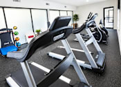 Thumbnail 12 of 21 - Fitness center with cardio equipment at Stonetree Apartments, Georgia