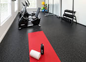 Thumbnail 10 of 21 - Home fitness center with exercise equipment at Stonetree Apartments, Georgia, 30344