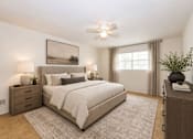 Thumbnail 19 of 21 - Spacious bedroom with neutral decor and ceiling fan at Stonetree Apartments, East Point, GA 30344