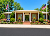 Thumbnail 2 of 21 - Information center and clubhouse entrance with brick facade at Stonetree Apartments, East Point, GA 30344
