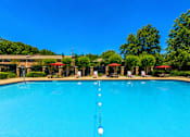 Thumbnail 8 of 21 - Resort style swimming pool with lounge seating at Stonetree Apartments, East Point, GA