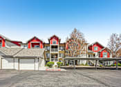 Thumbnail 35 of 36 - A row of houses with a clear blue sky above them.