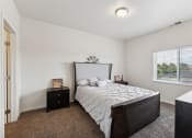Thumbnail 22 of 56 - a bedroom with a large bed and a window