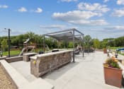 Thumbnail 42 of 56 - a patio with a seating area and a playground in a park