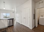 Thumbnail 8 of 56 - an empty kitchen with white cabinets and a white refrigerator and a sink
