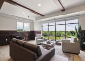 Thumbnail 45 of 56 - a living room with couches and chairs and a large window
