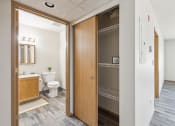 Thumbnail 13 of 31 - a bathroom with a toilet and a wooden door