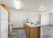 Thumbnail 4 of 31 - a kitchen with an island and a white refrigerator