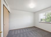 Thumbnail 11 of 31 - an empty room with carpet and a window