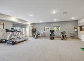 Thumbnail 36 of 58 - the gym with treadmills and weights in a home gym with a large window