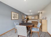Thumbnail 44 of 58 - a dining room with a table and chairs and a living room