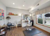 Thumbnail 43 of 58 - a living room with a table and chairs and a kitchen with a large window